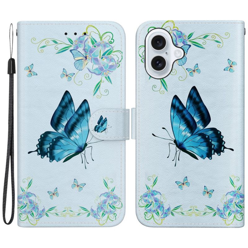 Etui Folio Do iPhone 16 Niebieski Motyl I Kwiaty Z Paskiem