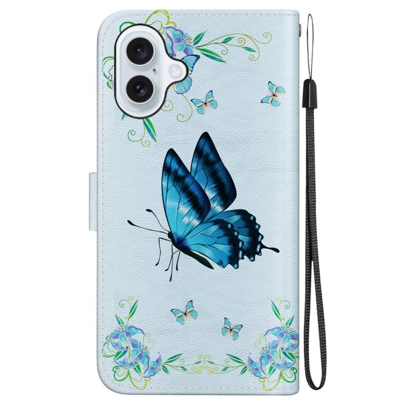 Etui Folio Do iPhone 16 Niebieski Motyl I Kwiaty Z Paskiem