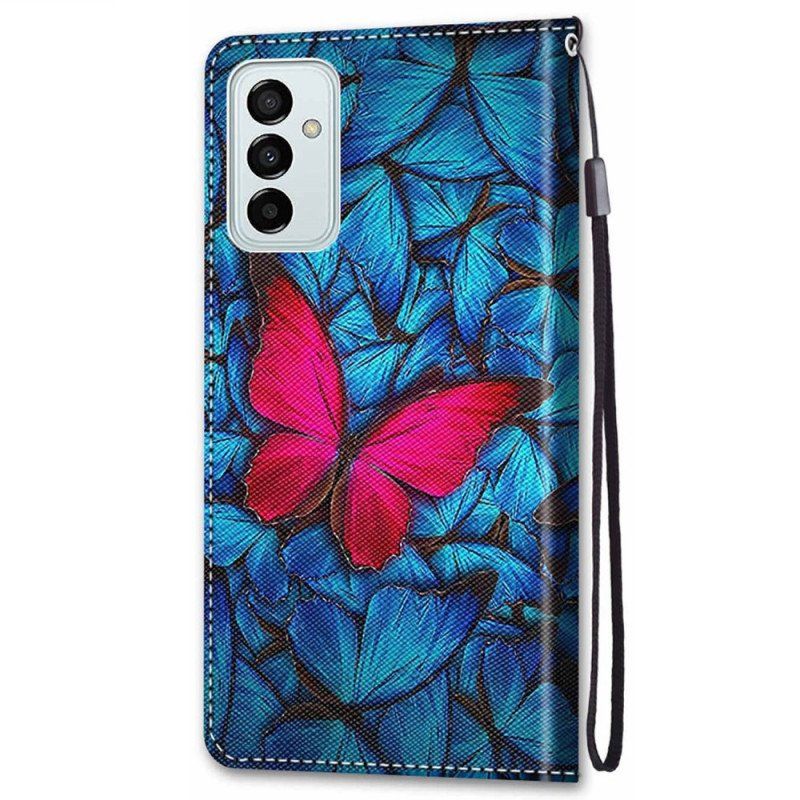 Etui Folio do Samsung Galaxy M23 5G Czerwony Motyl Niebieskim Tle