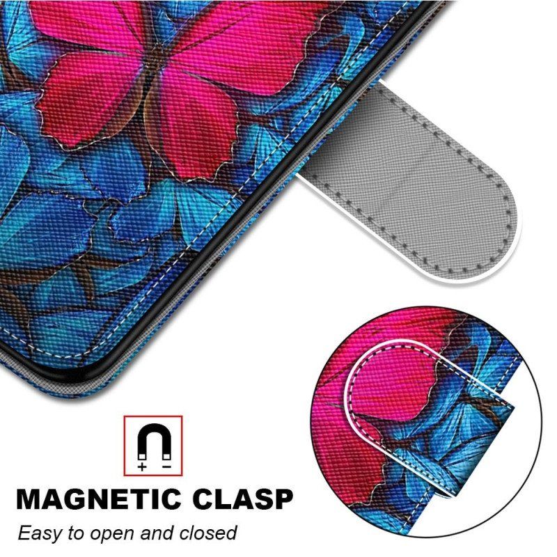 Etui Folio do Samsung Galaxy S23 Ultra 5G Czerwony Motyl Niebieskim Tle