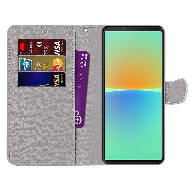 Etui Folio do Sony Xperia 10 IV Czerwony Motyl Niebieskim Tle