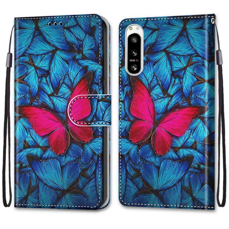 Etui Folio do Sony Xperia 5 IV Czerwony Motyl Niebieskim Tle