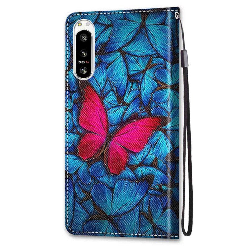 Etui Folio do Sony Xperia 5 IV Czerwony Motyl Niebieskim Tle